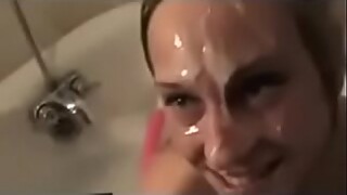 Blonde in the bathtub sucks off a black cock and gets a hugely messy facial